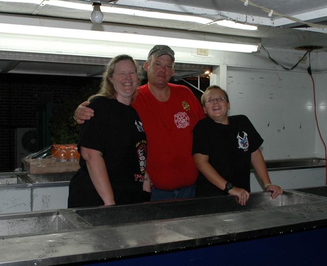 The Andros Family manning the drink booth. Kevin Andros Sr. (center) also the Dept. Parade chairman. Carnival '12